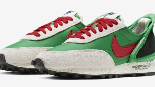 Side view of green, red, and black Nike sneakers.